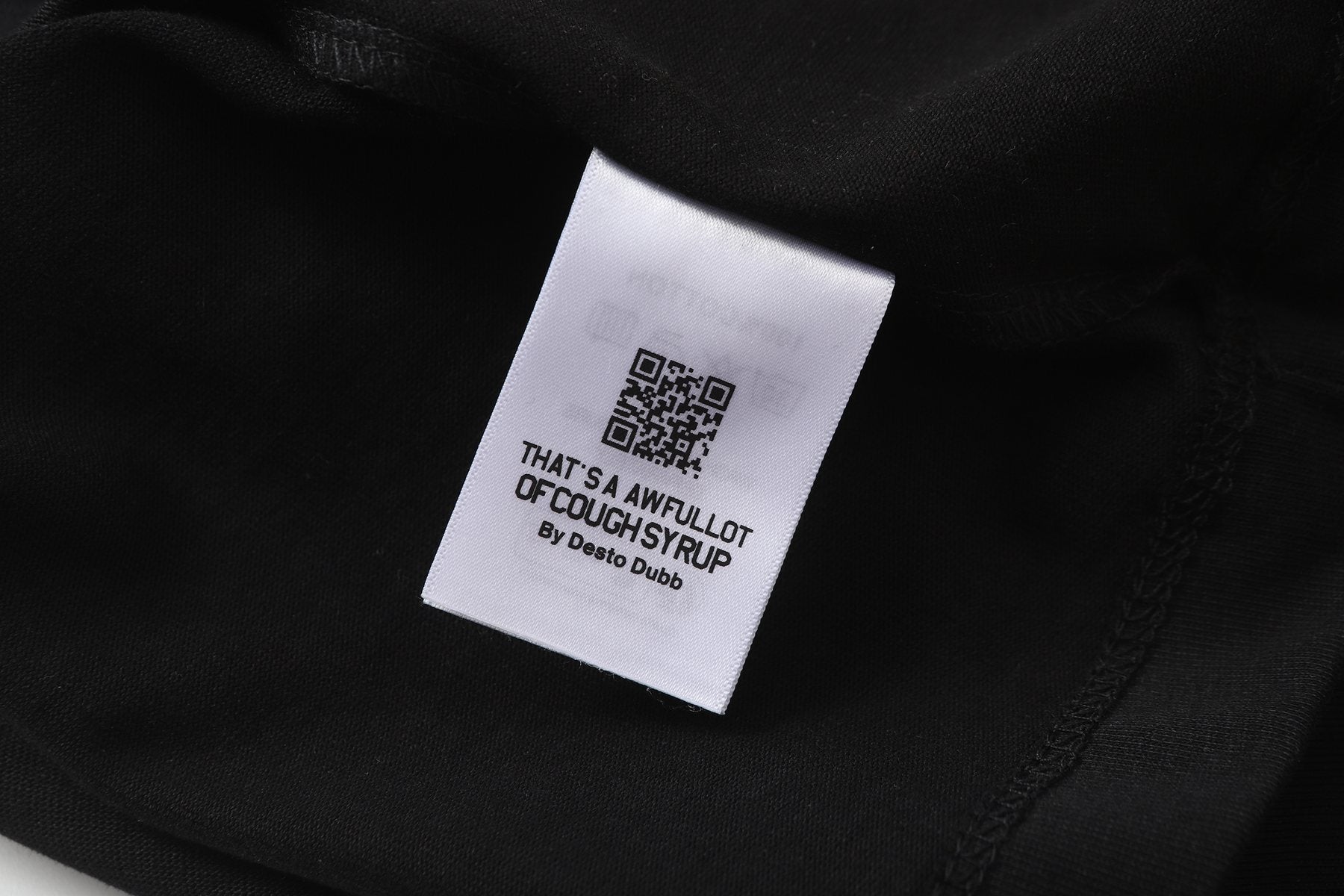 THAT'S A AWFUL LOT OF COUGH SYRUP Eiffel Tower Graphic T-Shirt — hang_tag