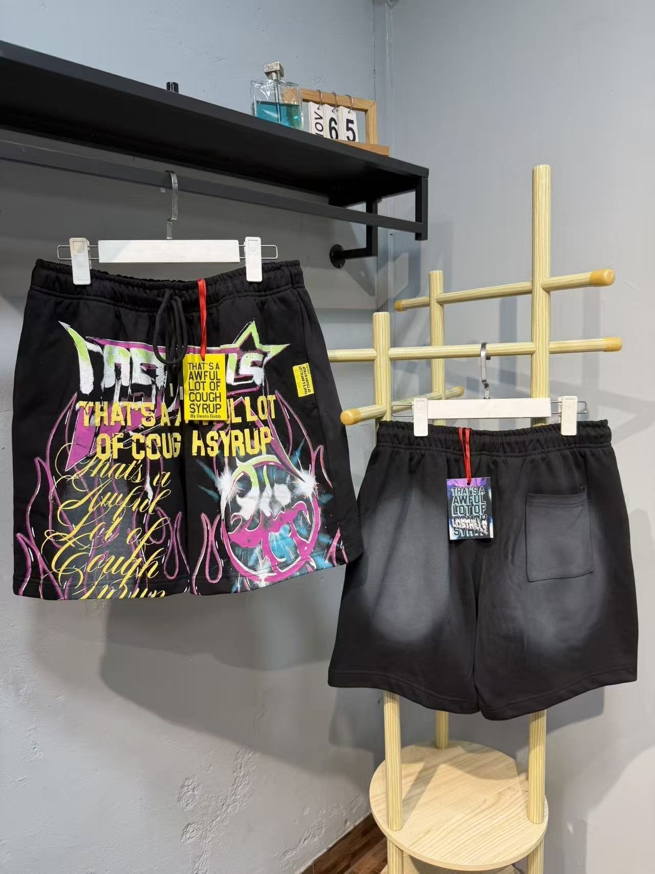 THAT'S A AWFUL LOT OF COUGH SYRUP Colorful Graffiti Script Shorts — front